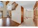 Hallway view highlighting the wood floors and natural light at 229 Springside Rd, Longwood, FL 32779