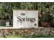 The Springs community entrance sign featuring stone base and lush landscaping at 229 Springside Rd, Longwood, FL 32779