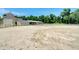 An exterior view shows the horse training arena surrounded by fencing and stables at 229 Springside Rd, Longwood, FL 32779