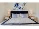 Bedroom features a plush bed and side tables with lamps at 2305 Biscotto Cir, Davenport, FL 33897