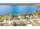 Aerial view of lakefront neighborhood with mature trees, green lawns and lake views at 250 Domino Dr, Orlando, FL 32805