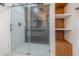 This bathroom features a glass shower and built-in wood shelving at 250 Domino Dr, Orlando, FL 32805