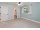 The bedroom features pale blue walls, a ceiling fan, and wood-look floors at 250 Domino Dr, Orlando, FL 32805