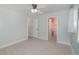 This bedroom has pale blue walls, wood-look floors, and two open doorways at 250 Domino Dr, Orlando, FL 32805