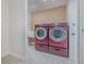 This laundry room features a matching red washer and dryer set and tile floors at 250 Domino Dr, Orlando, FL 32805