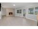 Cozy living room with brick fireplace, and a glass door that lets in lots of light at 250 Domino Dr, Orlando, FL 32805