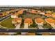 Aerial neighborhood view of terracotta roofs, attached garages, manicured landscaping, and pools at 2610 Rosemont Cir, Davenport, FL 33837