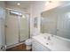 Clean bathroom featuring tiled shower, white sink, and large mirror at 2610 Rosemont Cir, Davenport, FL 33837