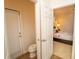 Bathroom with a door leading to the backyard and another door to the bedroom at 2610 Rosemont Cir, Davenport, FL 33837