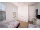 Cozy bedroom with white walls, featuring twin beds, and natural lighting at 2610 Rosemont Cir, Davenport, FL 33837