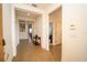 Bright hallway with neutral tile flooring, leading to living spaces with modern lighting and a clean, open feel at 2610 Rosemont Cir, Davenport, FL 33837