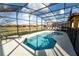 Enclosed pool area with -safety fence and lots of patio furniture at 2610 Rosemont Cir, Davenport, FL 33837