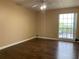 This bedroom features hardwood floors and a bright window at 285 Wymore Rd # 204, Altamonte Springs, FL 32714