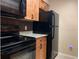 Cozy kitchen with wooden cabinets, tile backsplash, and black appliances at 285 Wymore Rd # 204, Altamonte Springs, FL 32714