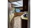 Kitchen featuring yellow countertops, wood cabinets, a drop ceiling, and views of the backyard at 2903 Clear Way, Orlando, FL 32805