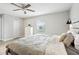 Neutral bedroom with wood-look floors, a ceiling fan, and closet at 304 Dover St, Orlando, FL 32811