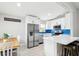 Modern kitchen featuring white cabinets, stainless steel appliances, and an eat-in kitchen at 304 Dover St, Orlando, FL 32811