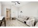 Relaxing living room featuring neutral tones, hardwood floors and a ceiling fan at 304 Dover St, Orlando, FL 32811