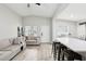 This living room features hardwood floors, ceiling fan, and is connected to the kitchen and dinning area at 304 Dover St, Orlando, FL 32811