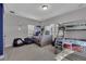 Spacious ' bedroom featuring carpet floors and two bunk beds with unique designs at 314 Muirfield Loop, Reunion, FL 34747