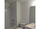 Bathroom includes a shower over the tub and a white single sink vanity at 3401 Shallot Dr # 107, Orlando, FL 32835