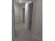 Upstairs hallway with white trim and doors at 3401 Shallot Dr # 107, Orlando, FL 32835