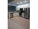 Kitchen featuring stainless steel appliances, granite countertops, and white cabinetry at 3401 Shallot Dr # 107, Orlando, FL 32835