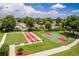 Bocce ball court and basketball court are surrounded by manicured lawns at 3567 Capland Ave, Clermont, FL 34711