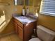 Bathroom with a modern single sink vanity and toilet at 3567 Capland Ave, Clermont, FL 34711