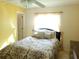 Bedroom featuring ceiling fan, window, and comfortable bed at 3567 Capland Ave, Clermont, FL 34711