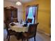 A formal dining room with coordinated furniture and elegant table setting at 3567 Capland Ave, Clermont, FL 34711