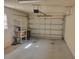 Garage with automatic door, showing some storage space at 3567 Capland Ave, Clermont, FL 34711