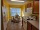 The kitchen includes a dining nook, a window, and modern appliances at 3567 Capland Ave, Clermont, FL 34711