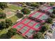 Aerial view of the tennis courts and bocce ball court at the community at 3567 Capland Ave, Clermont, FL 34711