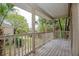 Private balcony overlooking mature trees offers a serene outdoor retreat at 385 Wymore Rd # 200, Altamonte Springs, FL 32714