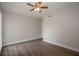 Bedroom with wood-look flooring, ceiling fan, and an attached entry at 385 Wymore Rd # 200, Altamonte Springs, FL 32714