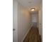 Hallway with wood-look flooring, fresh paint, and a simple light fixture at 385 Wymore Rd # 200, Altamonte Springs, FL 32714