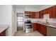 A view of the kitchen featuring granite countertops and stainless steel appliances at 385 Wymore Rd # 200, Altamonte Springs, FL 32714