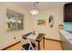 Dining area with tile floors, a small table and chairs, and a view of the kitchen at 400 Oakridge Blvd # 5, Daytona Beach, FL 32118