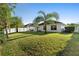 Beautifully landscaped backyard showcasing lush green lawn and a white privacy fence at 43 Pergola Pl, Ormond Beach, FL 32174