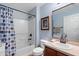 Bathroom featuring shower-tub combination, wood vanity, and a framed mirror in a well-lit space at 43 Pergola Pl, Ormond Beach, FL 32174