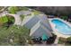 Aerial view of the community clubhouse and outdoor pool at 43 Pergola Pl, Ormond Beach, FL 32174