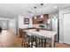 Kitchen island with granite counters and pendant lighting, stainless steel appliances at 43 Pergola Pl, Ormond Beach, FL 32174