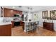 Kitchen with island breakfast bar, stainless steel appliances and granite countertops at 43 Pergola Pl, Ormond Beach, FL 32174