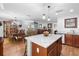 Eat-in kitchen featuring an island with granite countertops and pendant lighting at 43 Pergola Pl, Ormond Beach, FL 32174