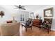 Cozy living room featuring hardwood floors, stylish furniture, and lots of natural light at 43 Pergola Pl, Ormond Beach, FL 32174