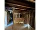 View of the interior of a house with exposed beams, studs, and plywood floors at 4384 Frances Ave, Sanford, FL 32773