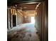 View of the interior of a house with exposed beams, studs, and plywood floors at 4384 Frances Ave, Sanford, FL 32773