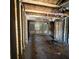 View of the interior of a house with exposed beams, studs, and plywood floors at 4384 Frances Ave, Sanford, FL 32773