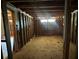 View of the interior of a house with exposed beams, studs, and plywood floors at 4384 Frances Ave, Sanford, FL 32773